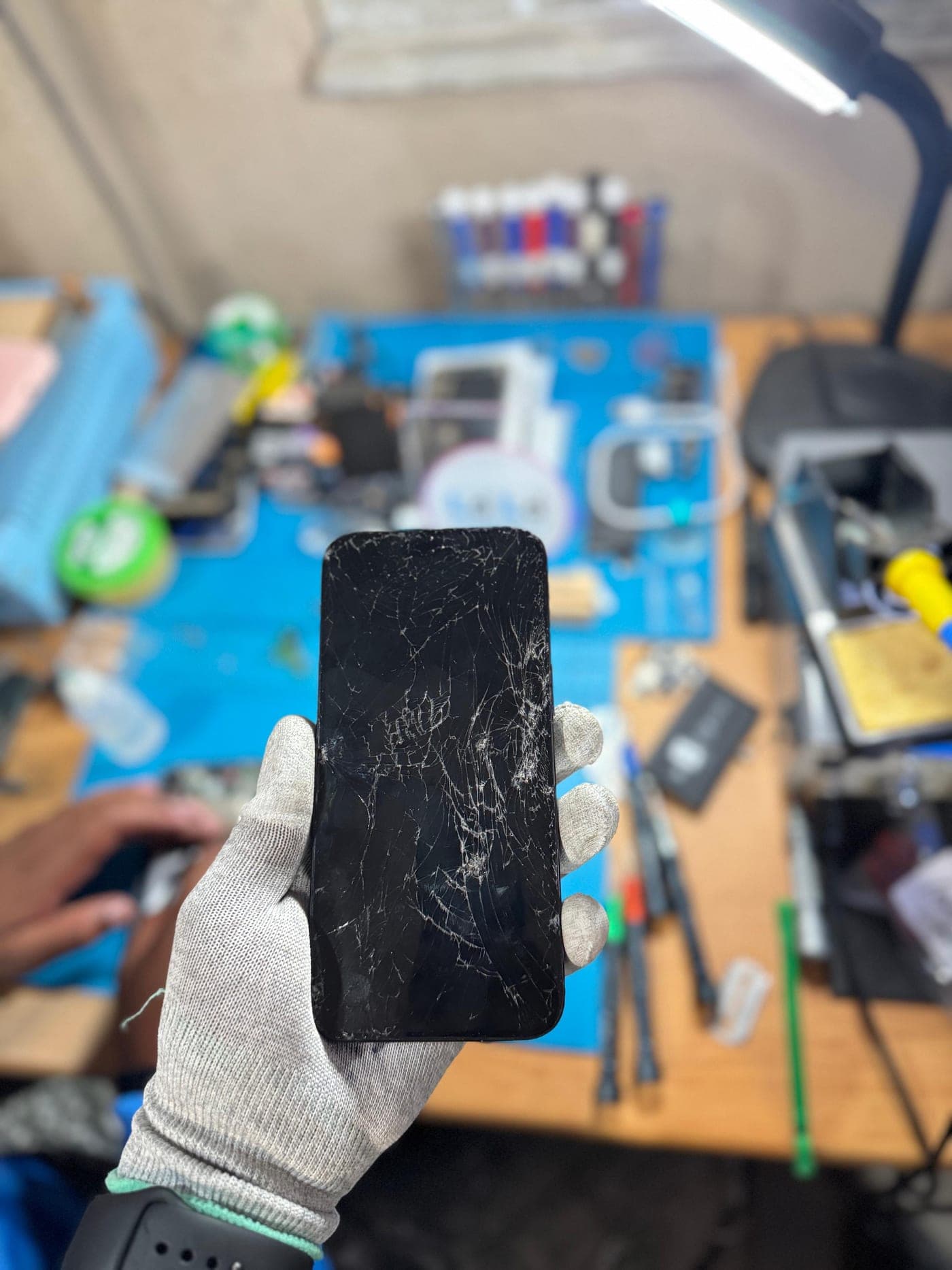 iPhone Screen Replacement - the device before repair, showing the damage
