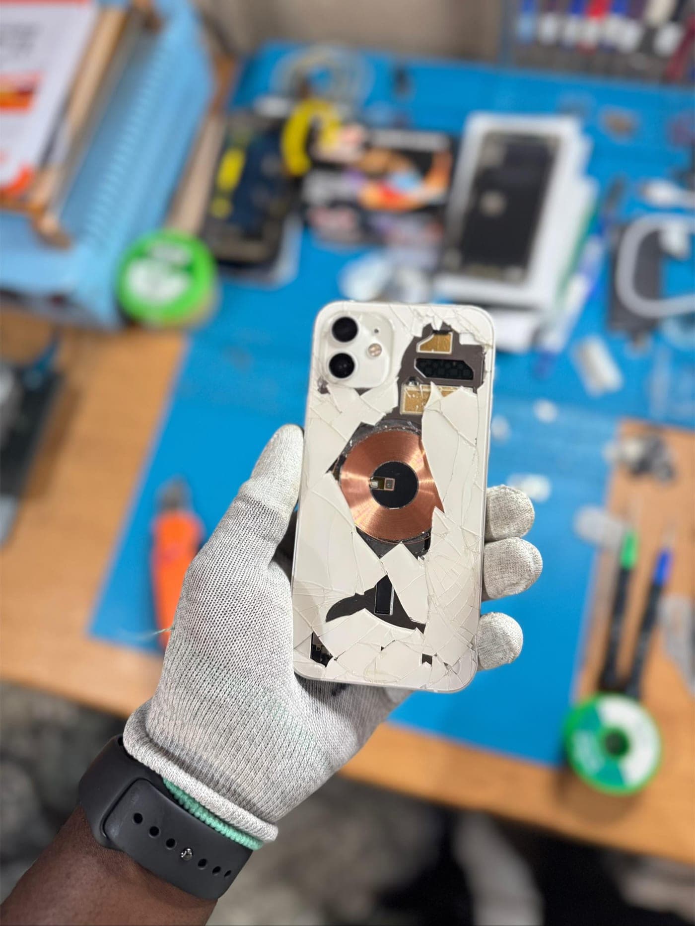 iPhone Back Glass Replacement - the device before repair, showing the damage