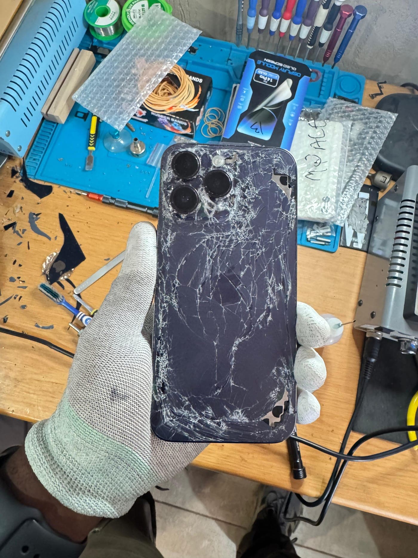 iPhone Back Glass Replacement - the device before repair, showing the damage