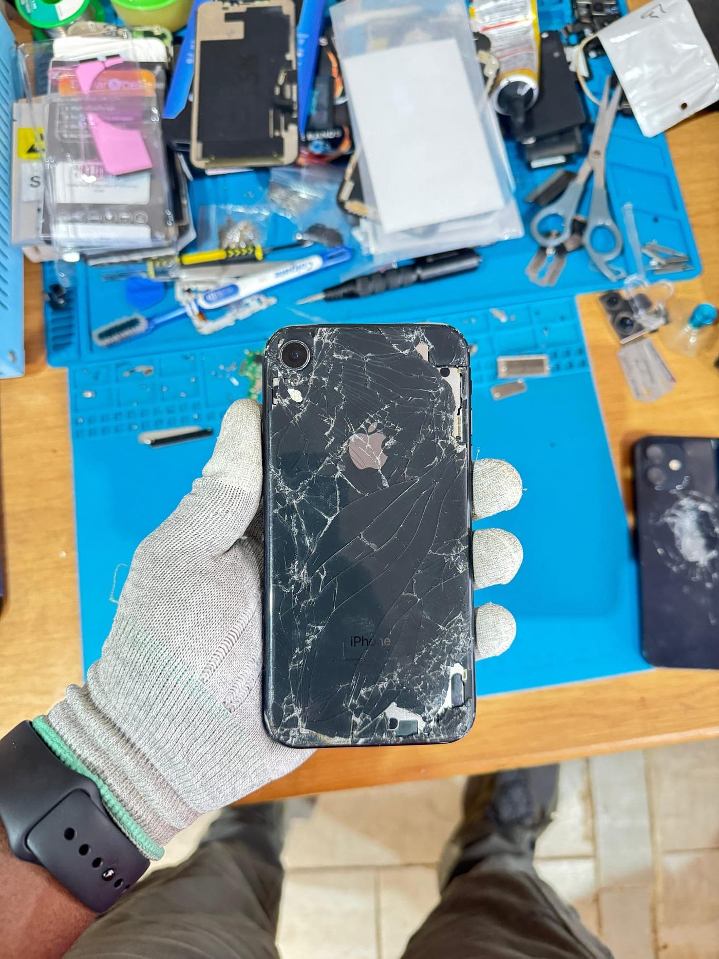 iPhone Back Glass Replacement - the device before repair, showing the damage