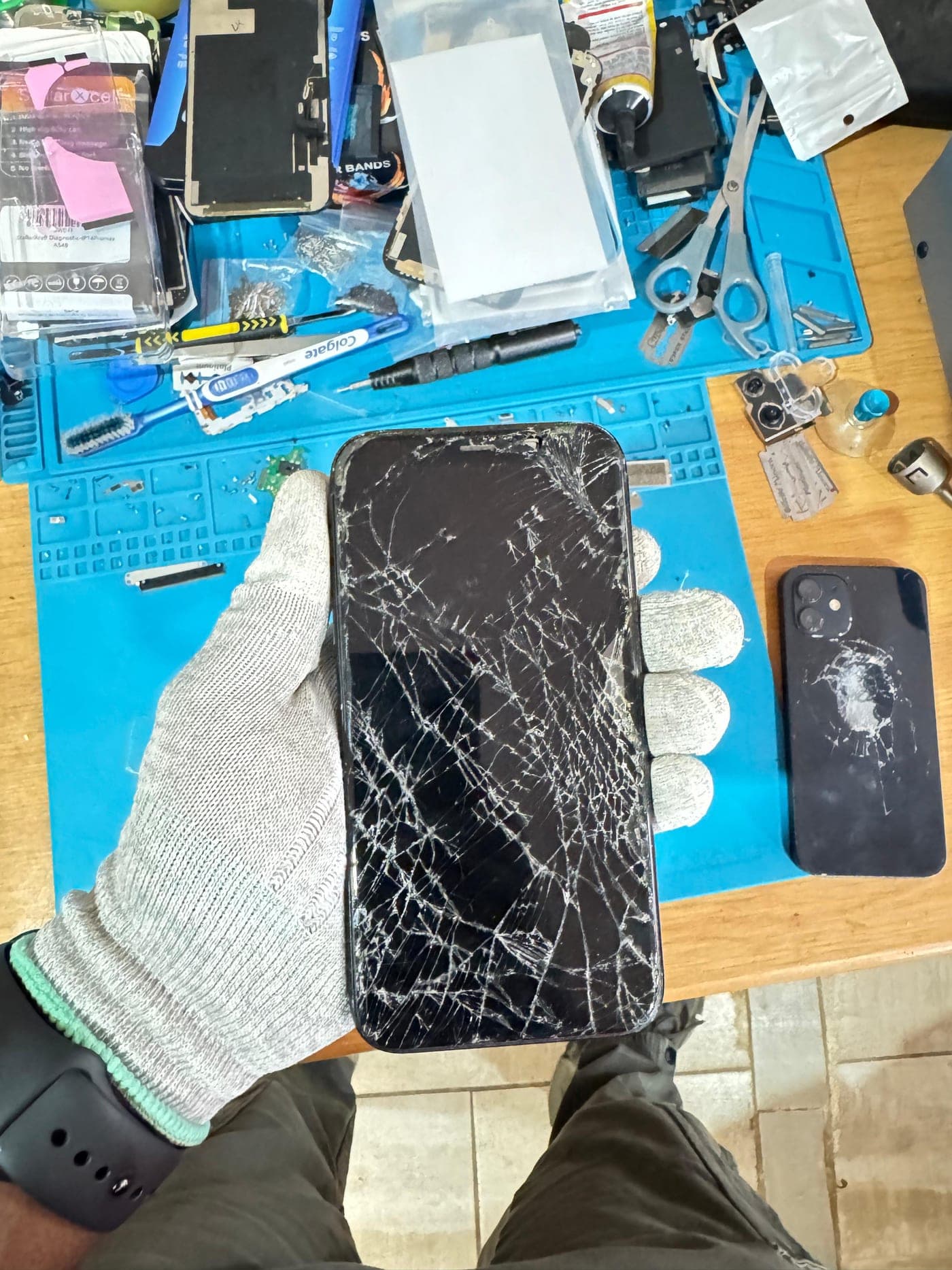 iPhone Screen Replacement - the device before repair, showing the damage